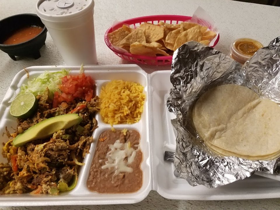 Menu page with tacos, quesadillas, and burritos.