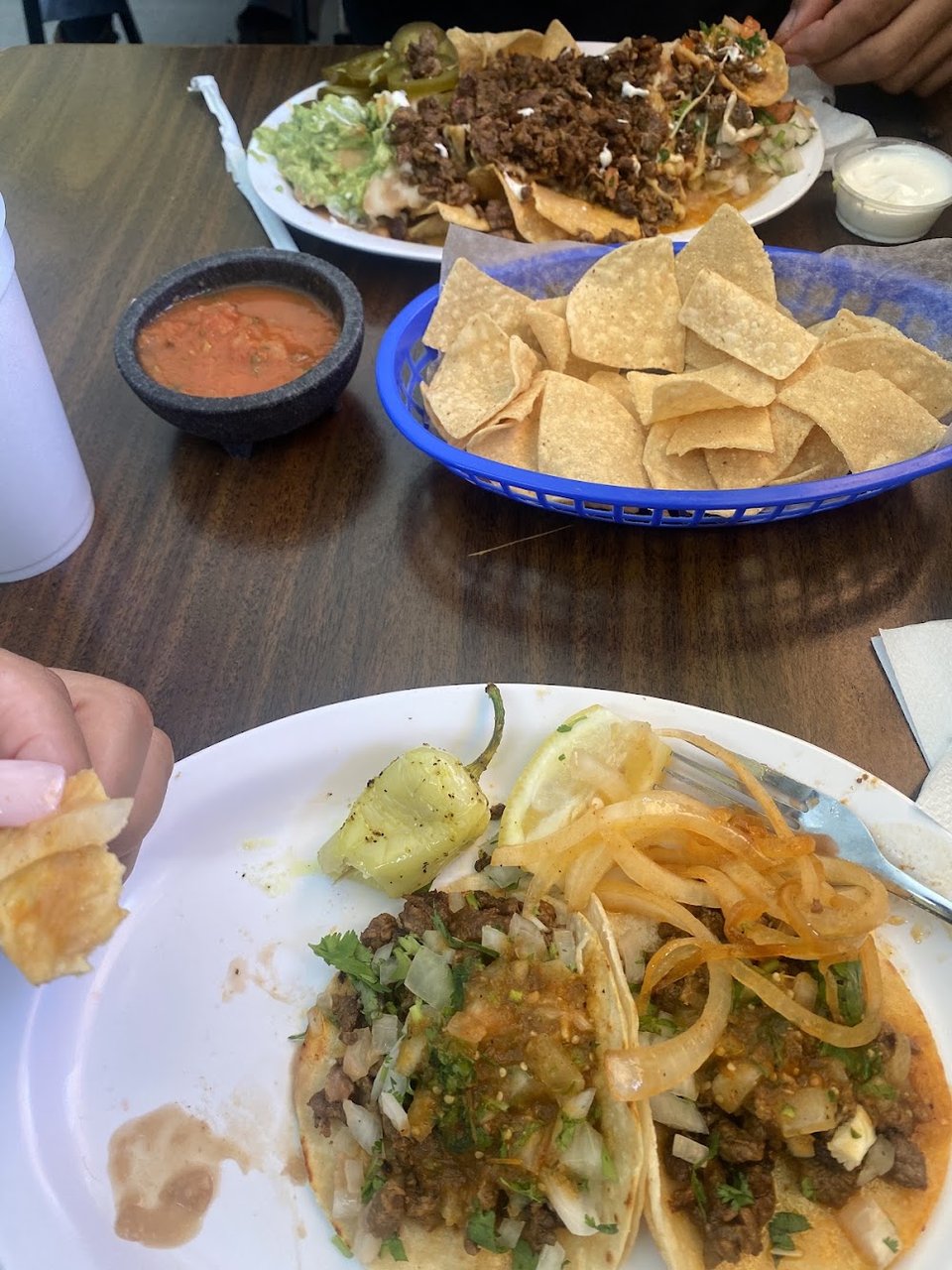 Restaurant menu showing salads, tortas, and tacos.