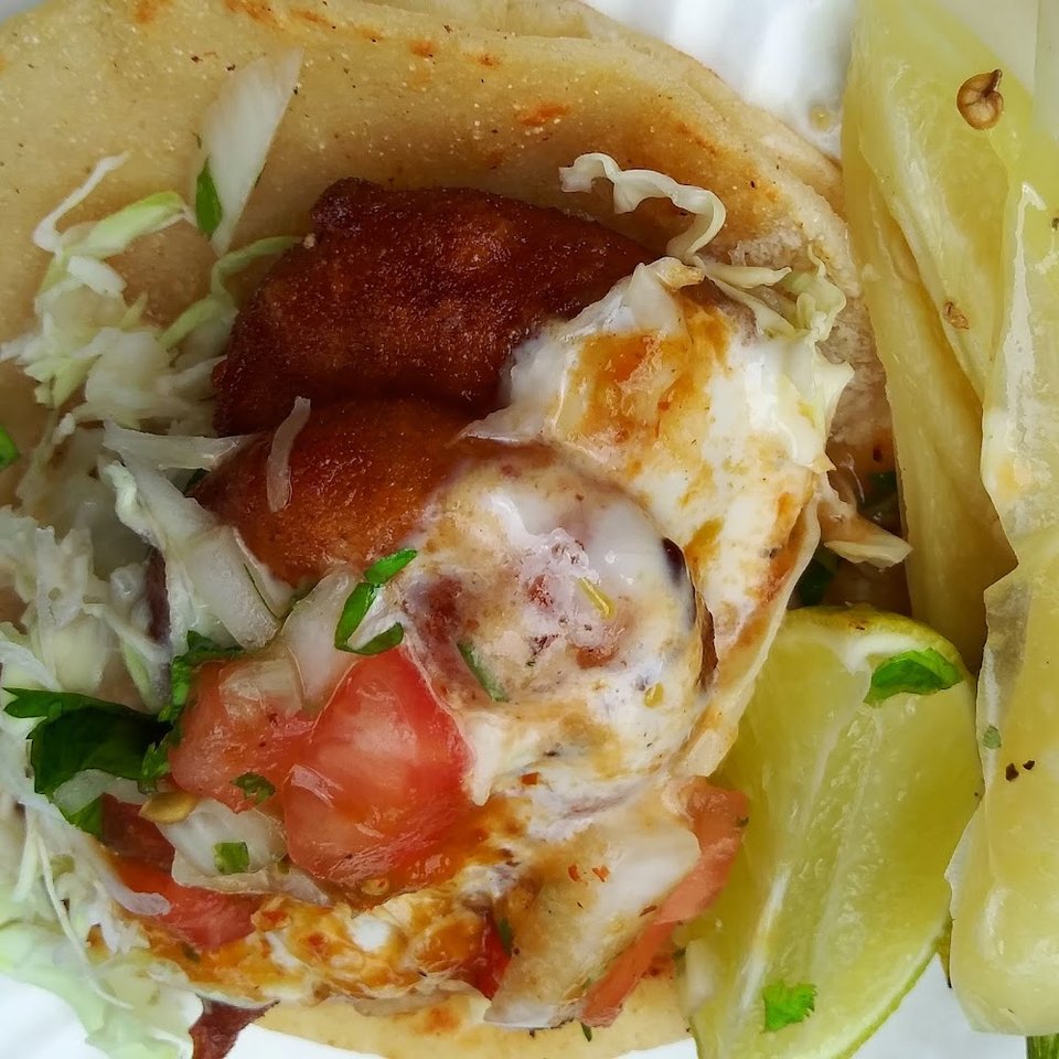 Restaurant menu showing salads, tortas, and tacos.
